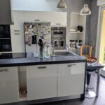 Modern open-plan kitchen in a welcoming host family home in Murianette near Grenoble.