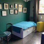 Modern private student bedroom with single bed, desk and contemporary décor in a French host family home near Grenoble.