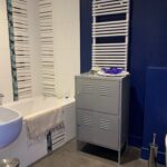 Modern private bathroom with bathtub in a French host family home near Grenoble.