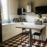 Modern white kitchen with central island, breakfast bar, and contemporary appliances.
