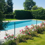 Private garden with swimming pool, flowers, and green hedges.